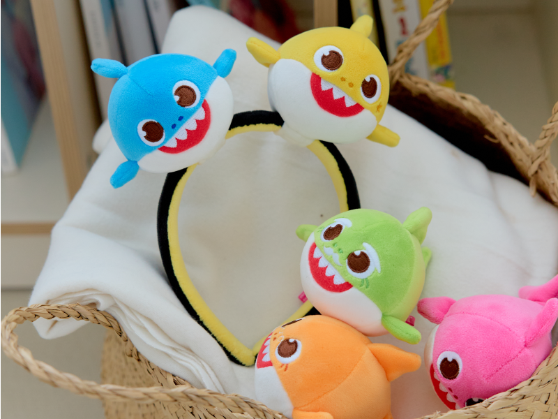 Baby Shark Squishy Charm Plush figures and headband in a basket