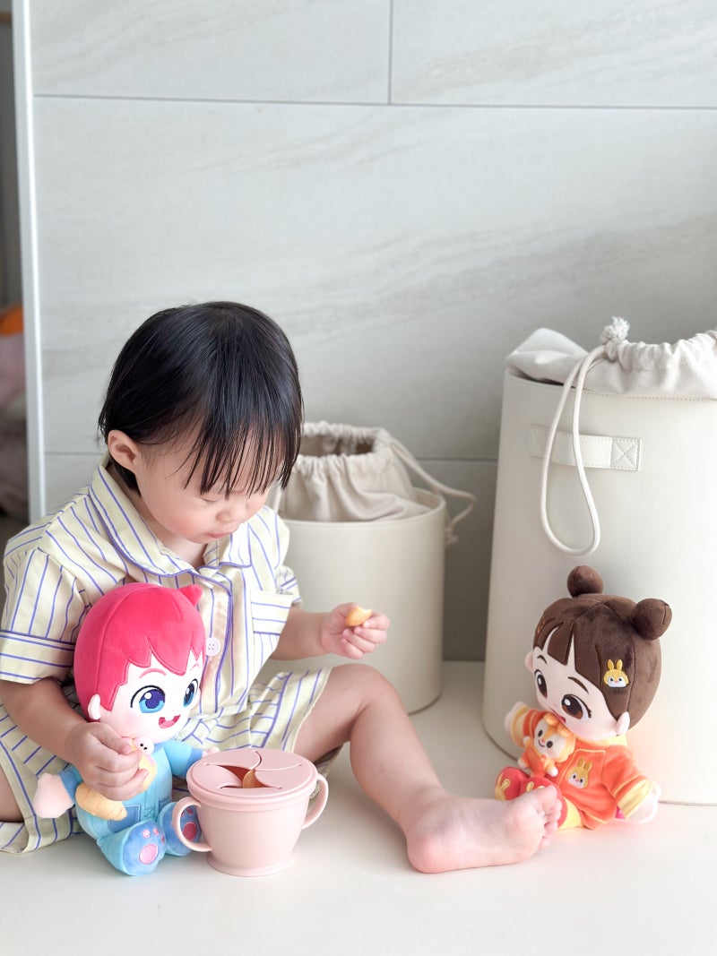Toddler cuddling a Bebefinn Magnetic Cuddle Plush